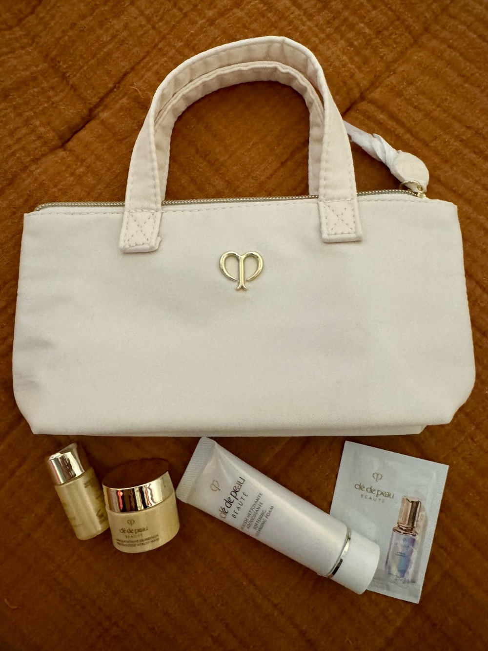 cle de peau Cream Cosmetic Tote with Gold Emblem